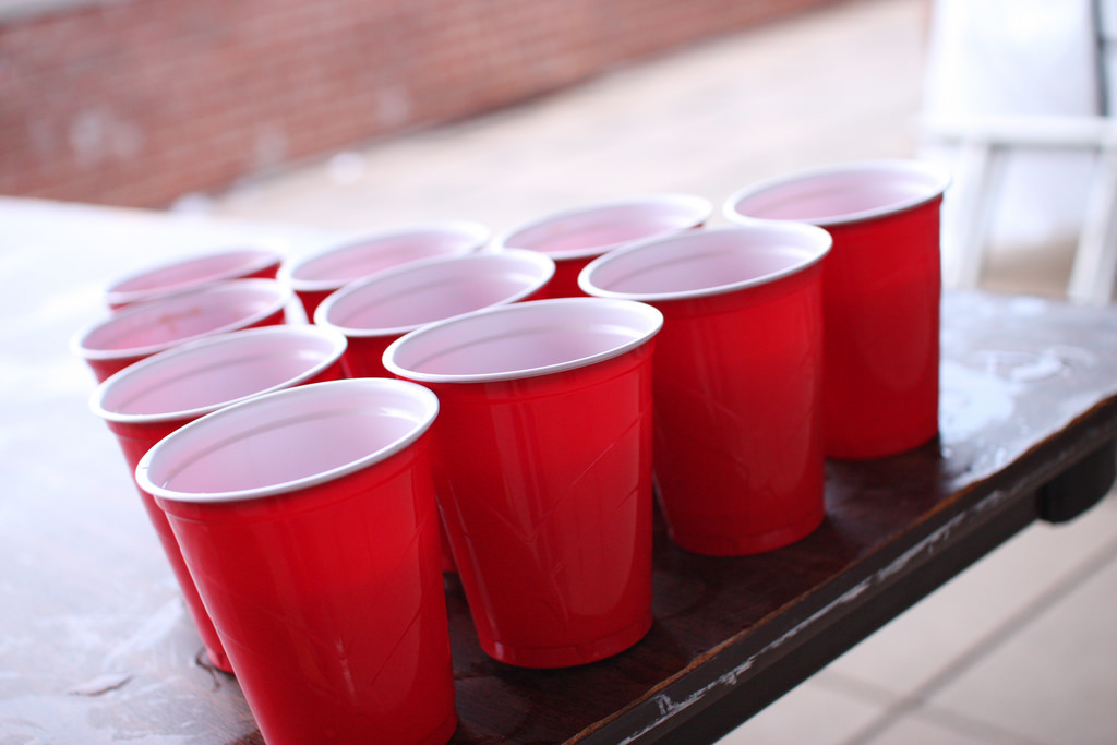 Beer pong cups on a table.