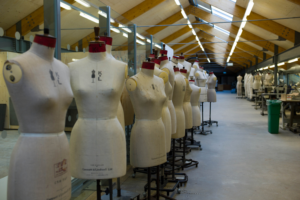 A Photo of fashion design mannequins in an empty warehouse.