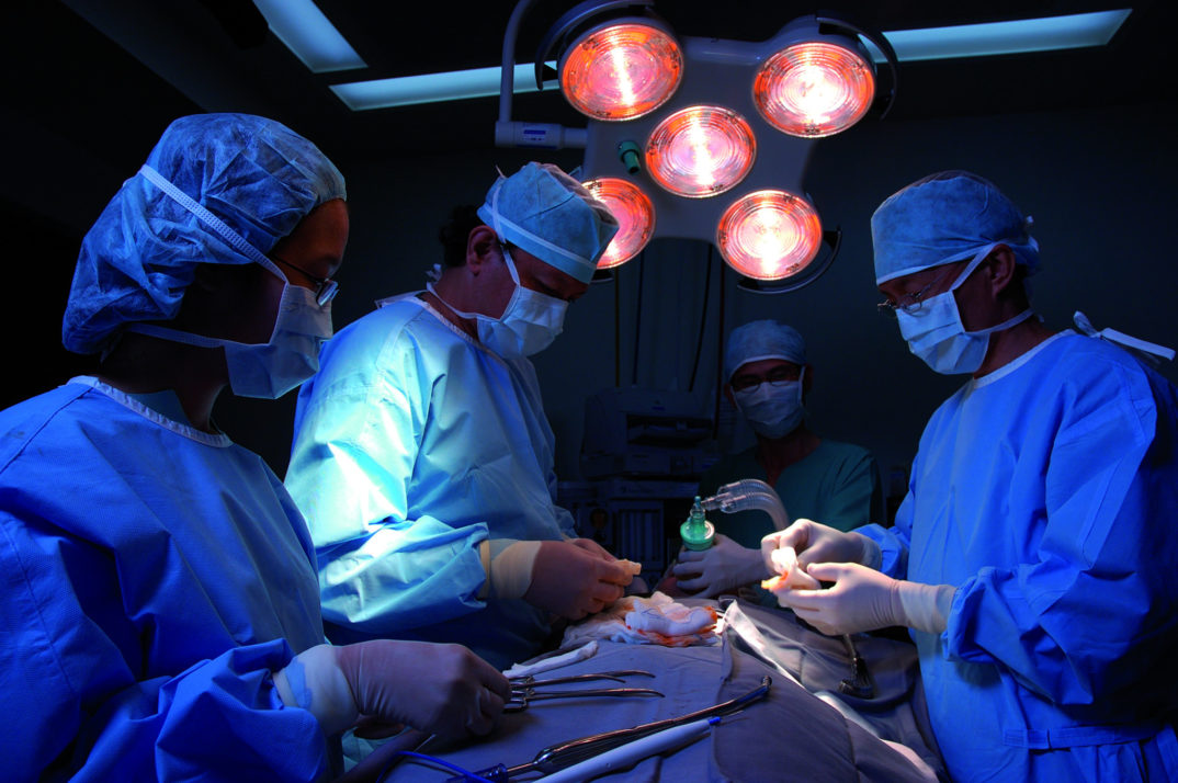 A photo of surgery within the operating room