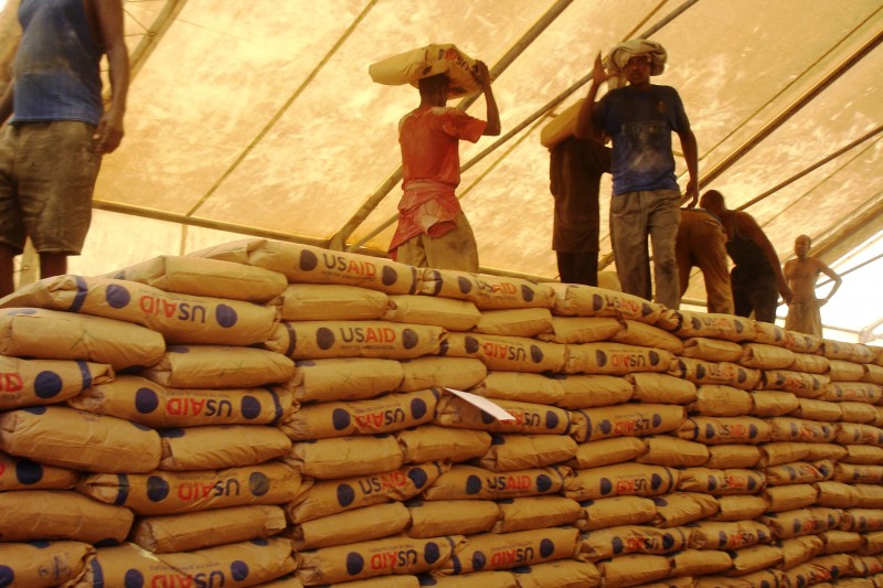 A photo of people unpacking food supplies from USAID.