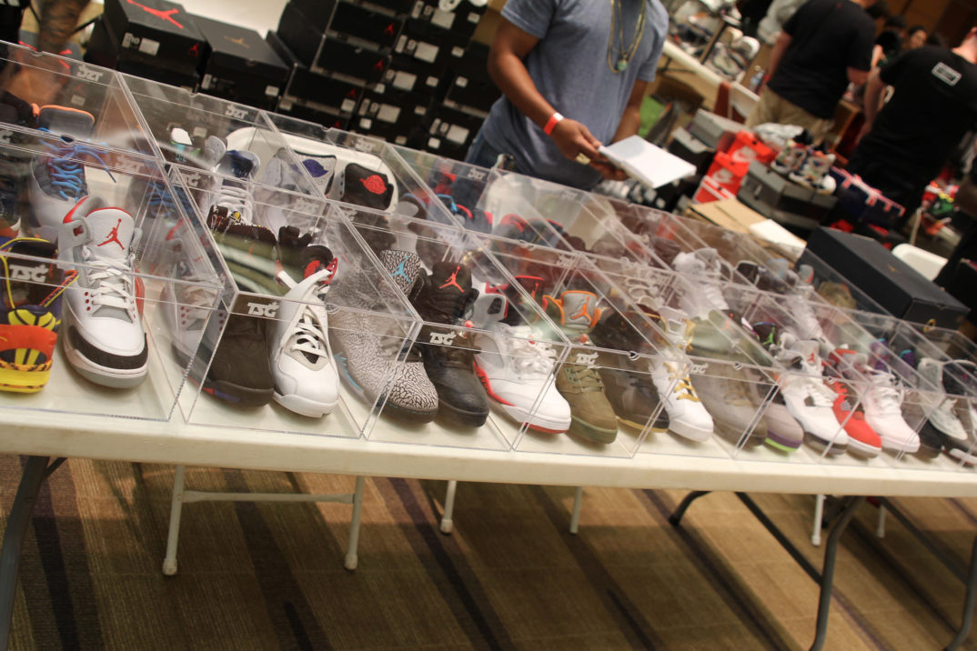 A large collection of Air Jordans sneakers in glass boxes.