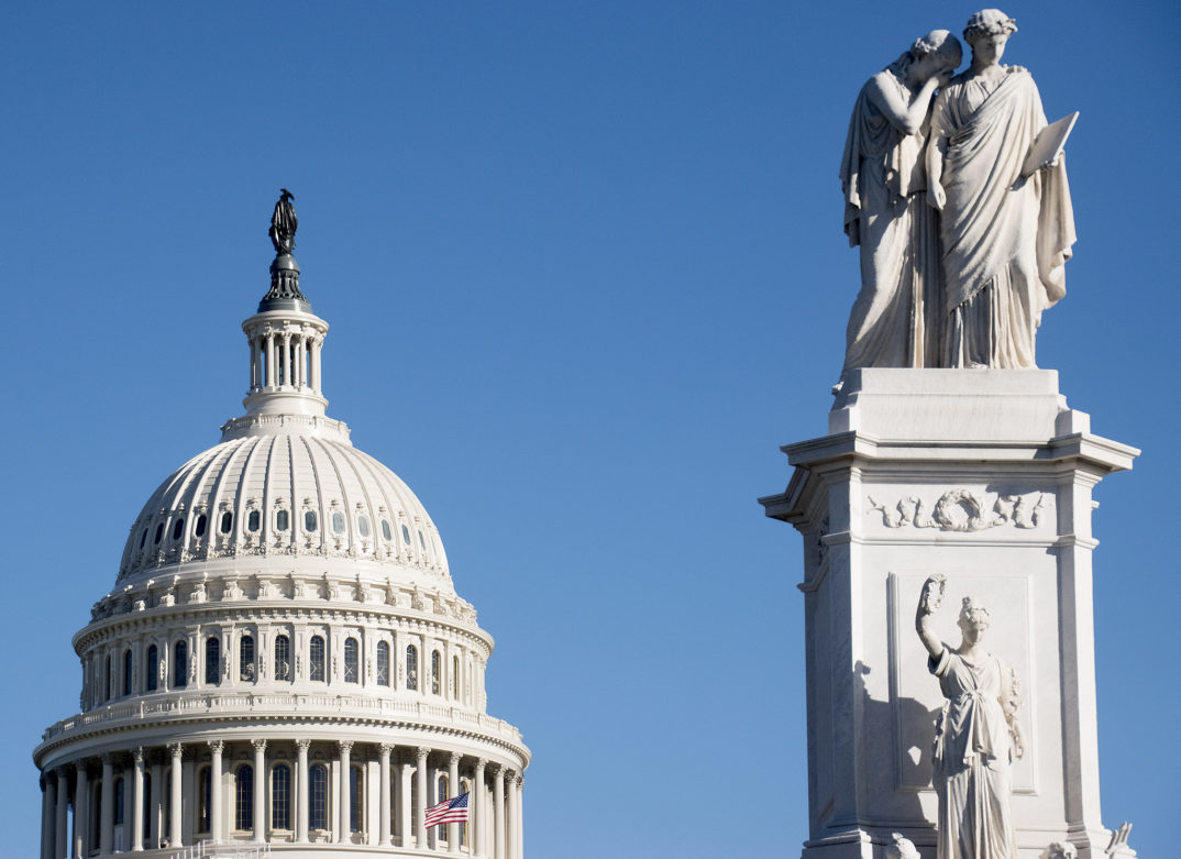 An image of the Capitol Hill dome with a statue in the foreground