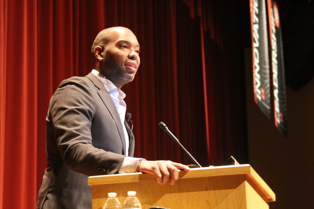 A photo of Ta-Nehisi Coates speaking at a lecture