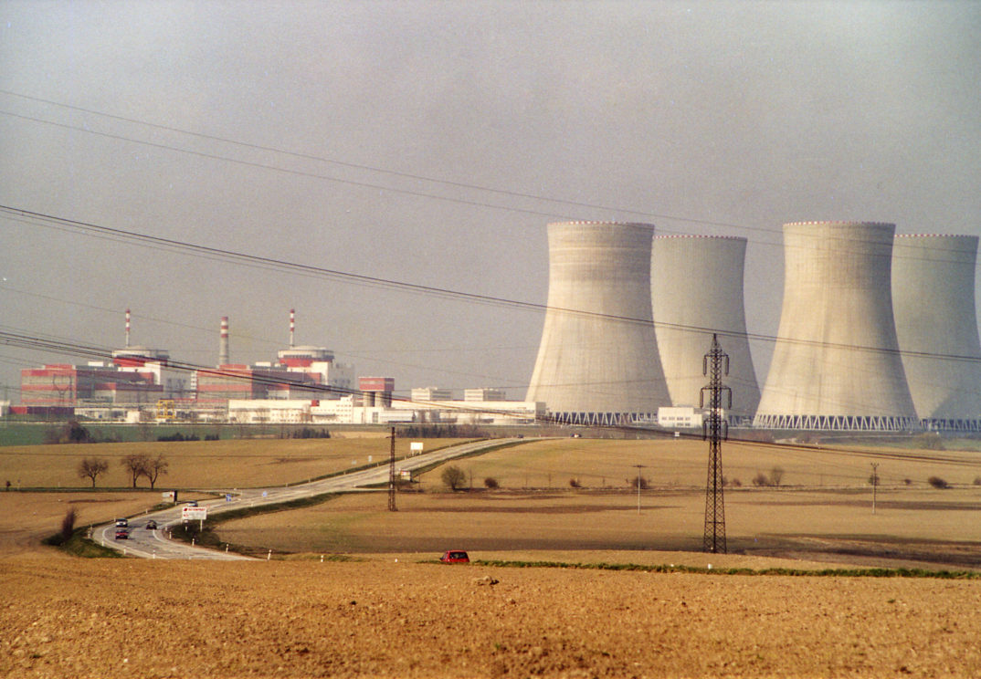 Photo of nuclear power plant next to a city