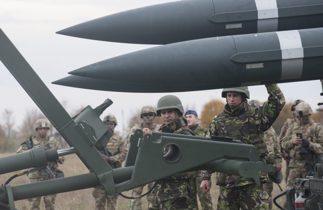 Photograph of missiles accompanied by Romanian troops