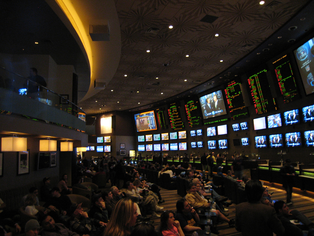 Image of gamblers in a sports betting hall.