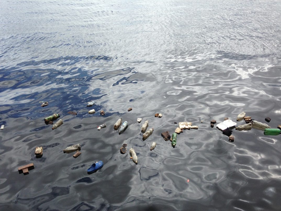 Image of plastic bottles floating in the ocean
