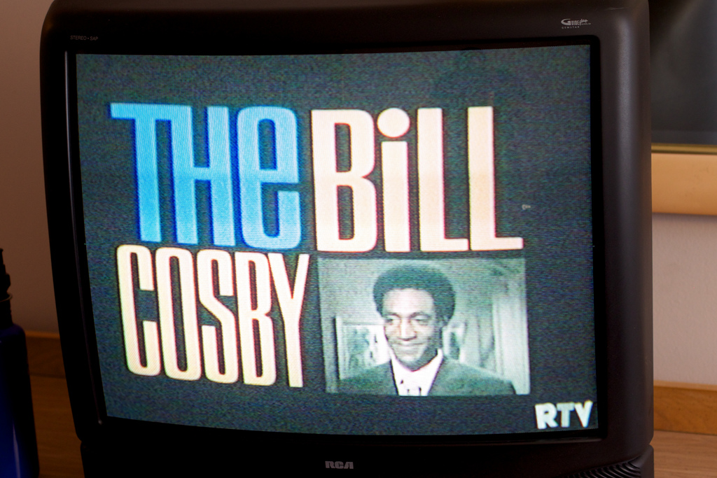 Photograph of an older TV with "The Bill Cosby" displayed on it