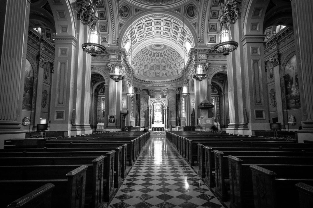 Black and white photograph of the inside of a cathedral