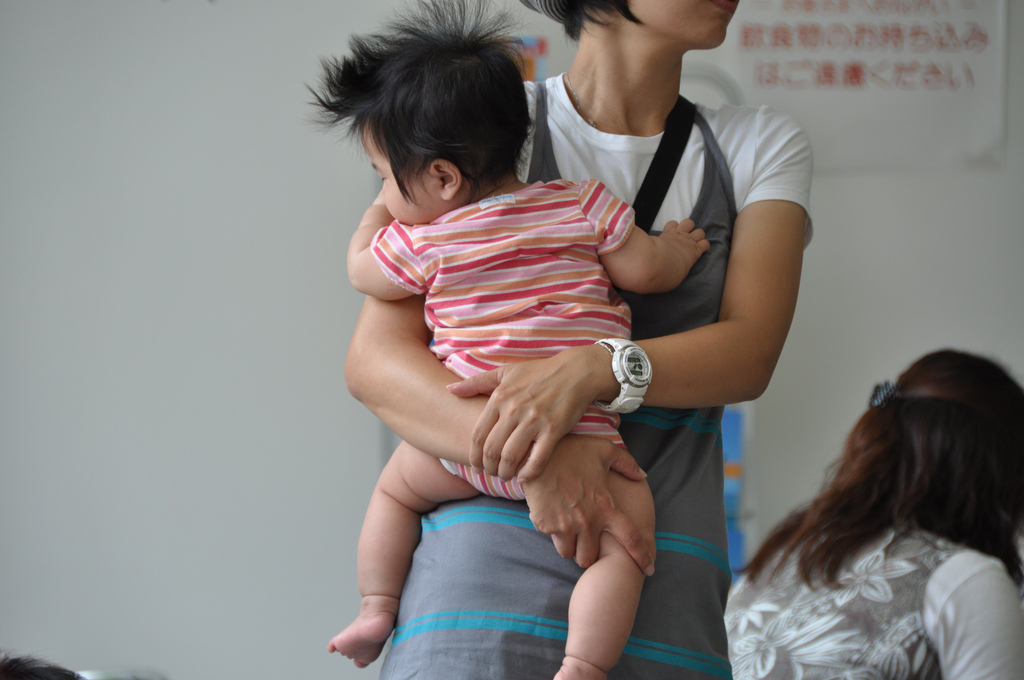 Image of a woman holding a young child