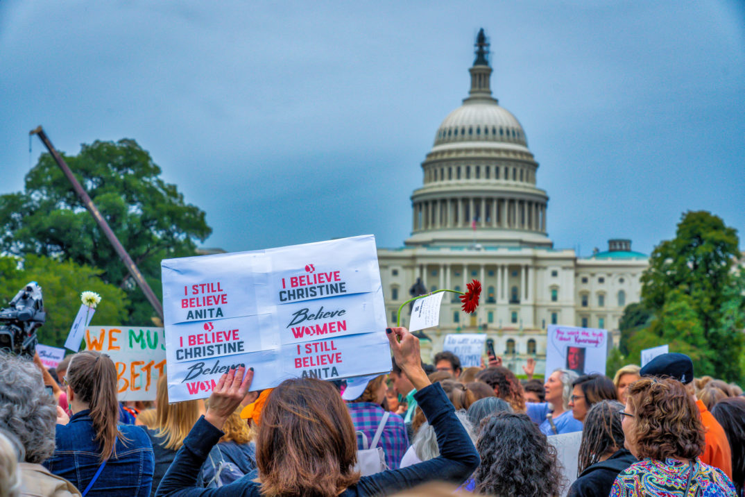 "Believe Women Vs Kavanaugh" by Mobilus In Mobili liscensed under CC BY 2.0 (Via Flickr).