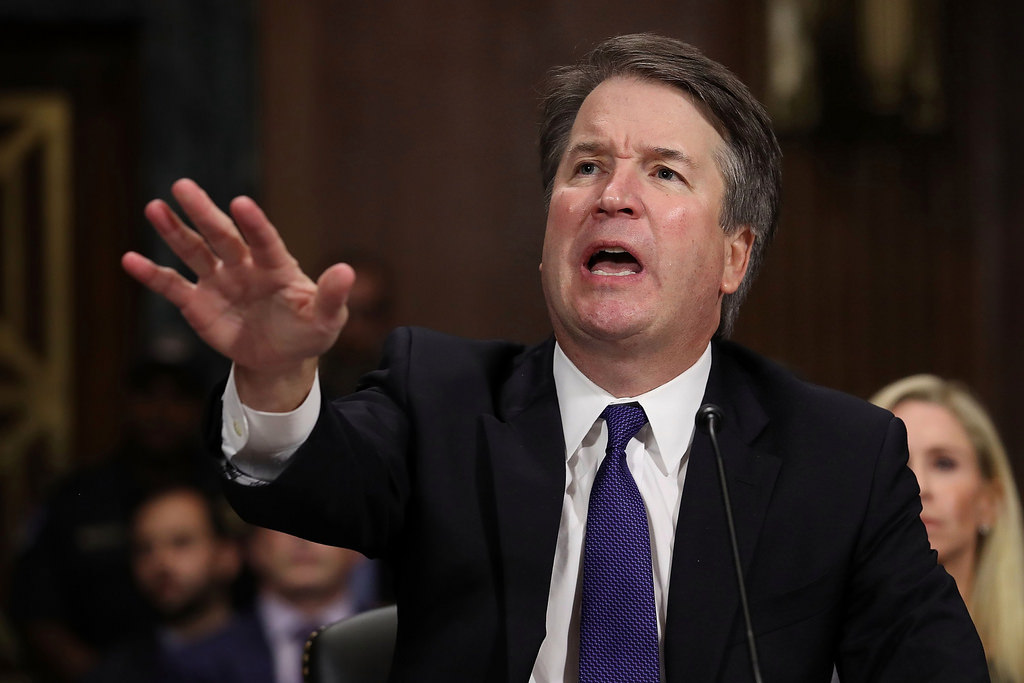 Photograph of Brett Kavanaugh with his hand raised in anger