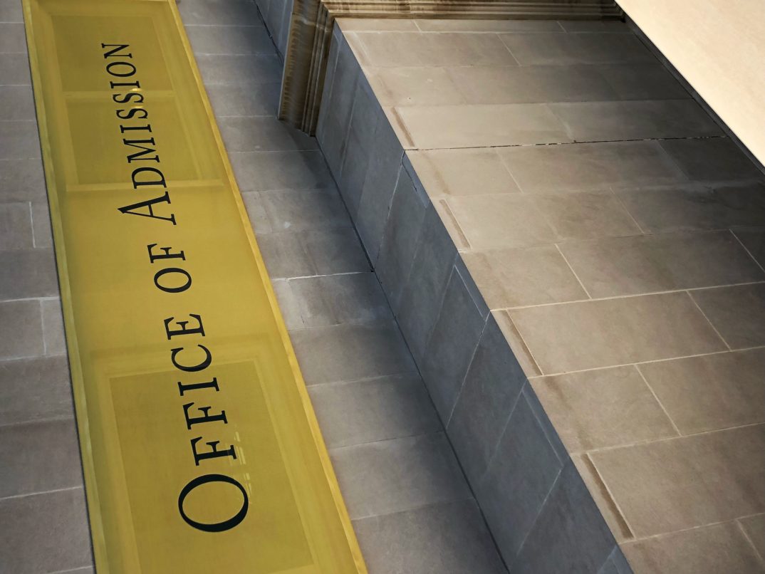 Photograph of a banner that says "office of admissions"