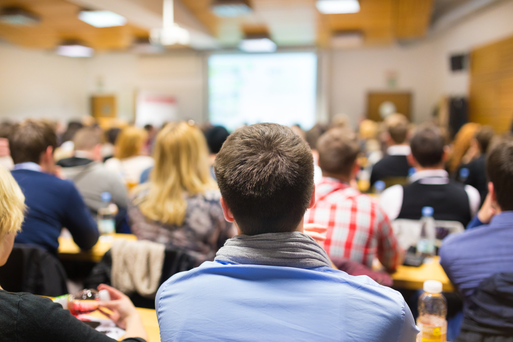 photograph of students packed into lecture