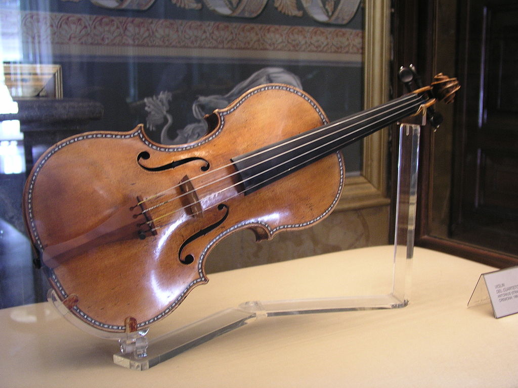 A Stradivarius violin displayed in a museum case