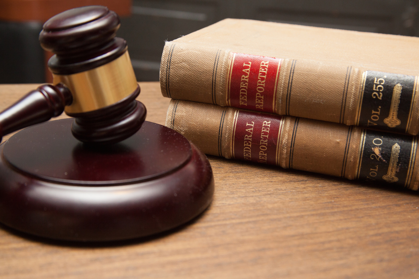 Photograph of a gavel next to two large books