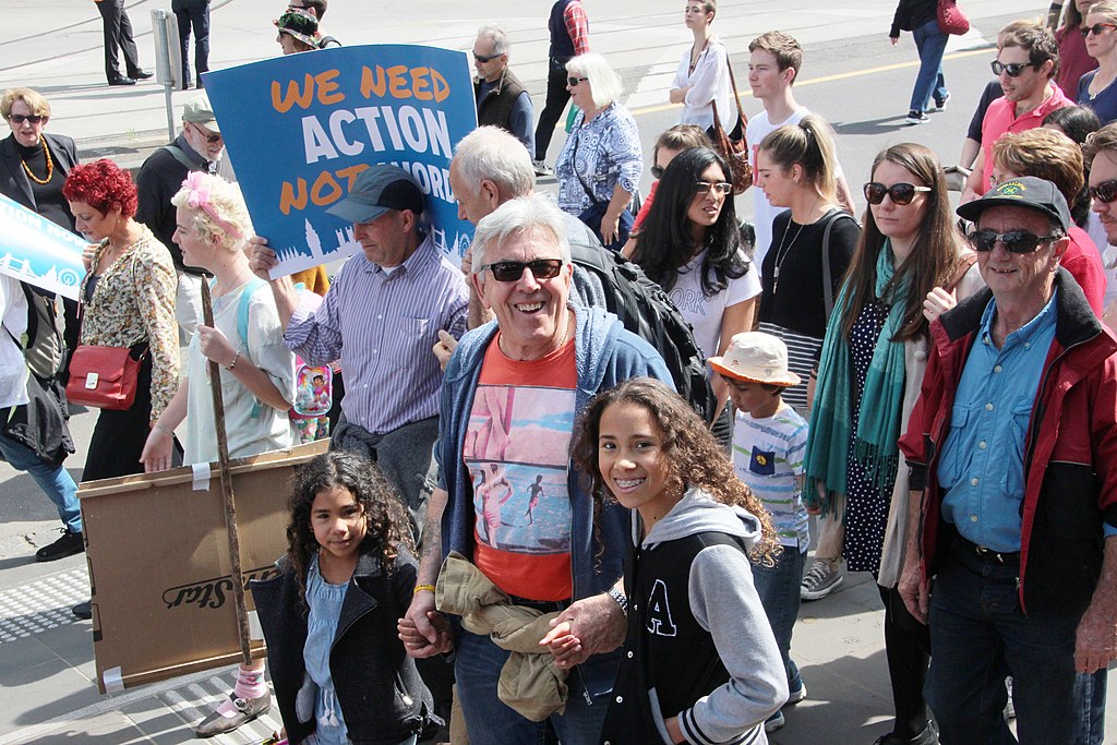 Photo of kids and older adults at a protest