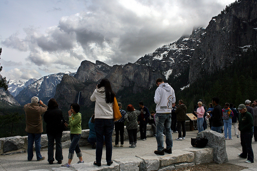 Photograph of tourists at scenic overview.