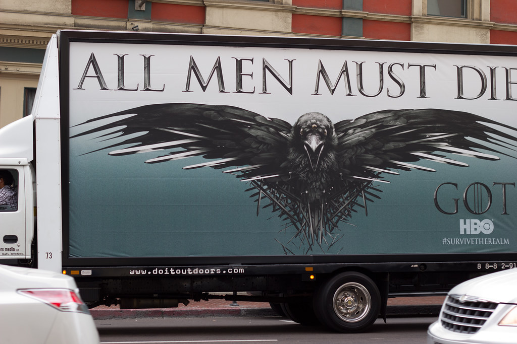 photograph of "all men must die" billboard for Game of Thrones
