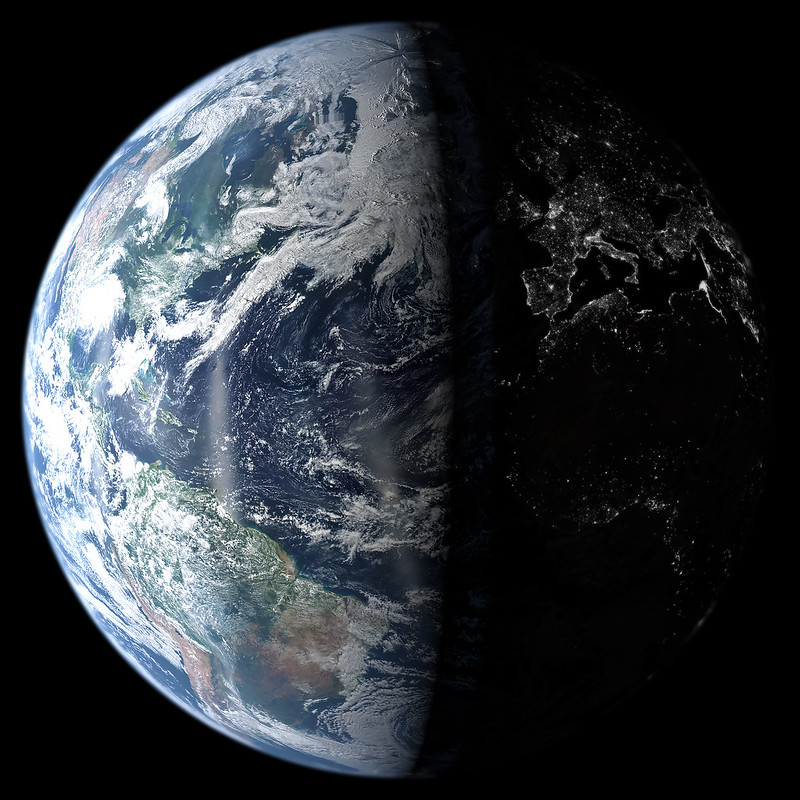 photograph of earth from space with one-half illuminated and the other half in darkness