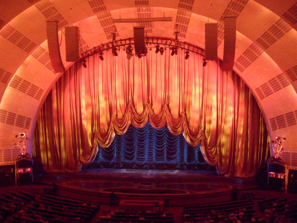 photograph of the curtains coming up at Radio City Music Hall