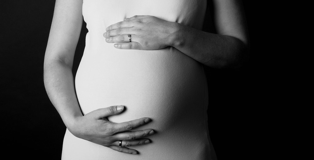 photograph of pregnant torso