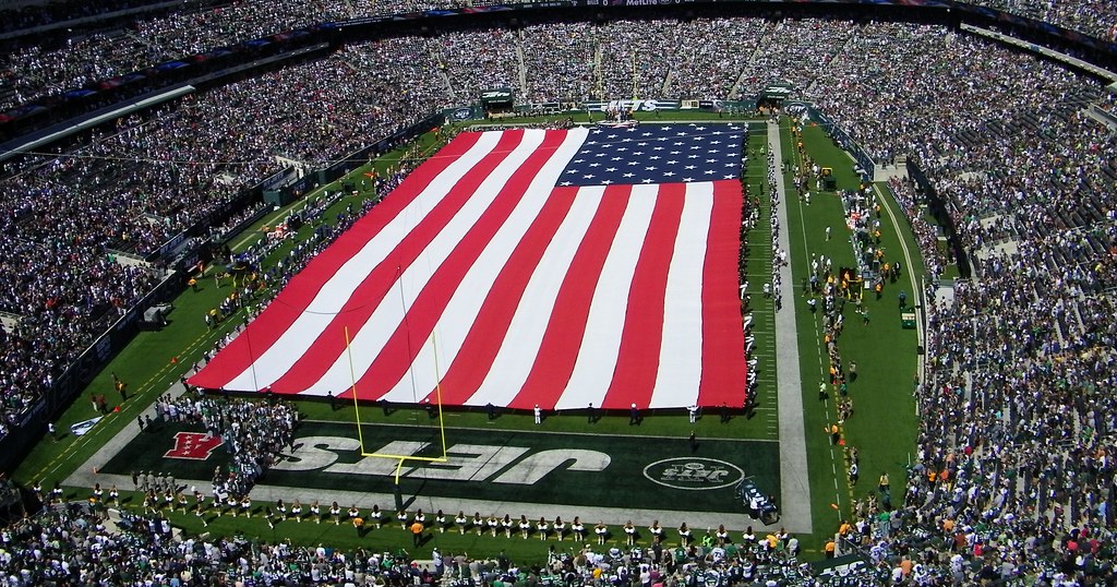 photograph of flag ceremony at NFL football game