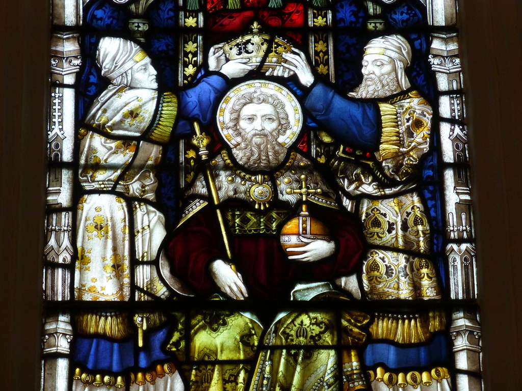 photograph of stained glass depicting crowning of religious figure