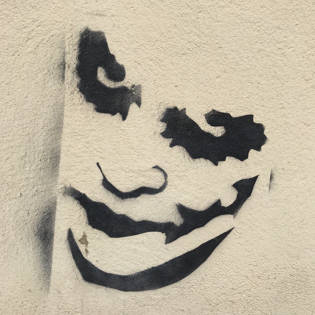 photograph of joker graffiti on wall