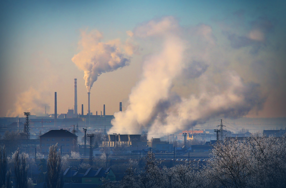 photograph of power plant smoke stacks