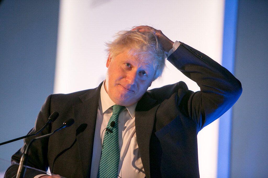 photograph of Boris Johnson scratching head