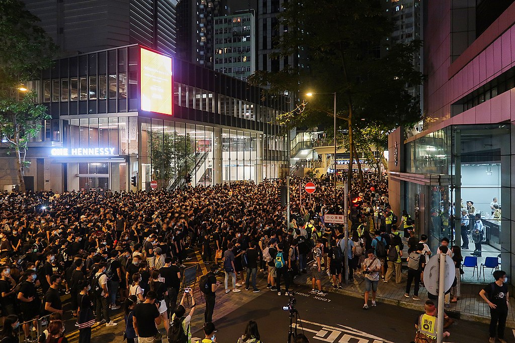 photograph of protest in front of police station