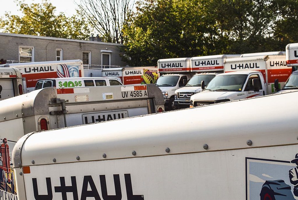 photograph of overcrowded UHaul rental lot