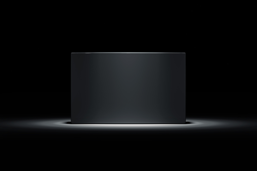 image of black box spotlighted and on pedestal