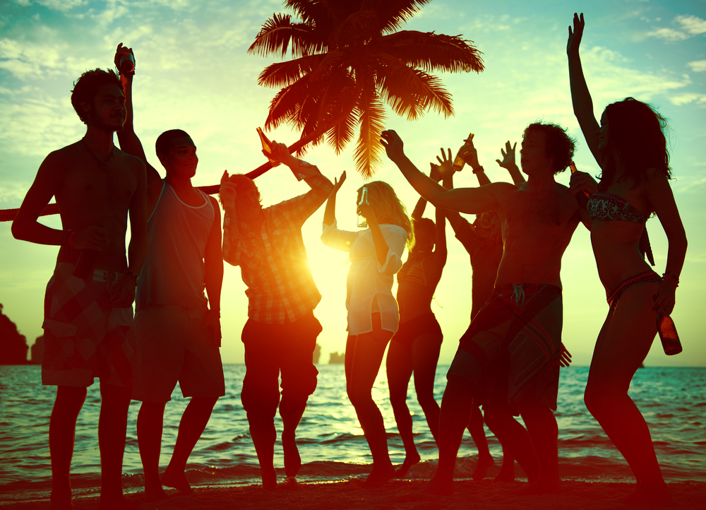 photograph of young people partying as the sun goes down