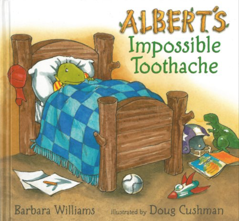 Cover image for the book Albert's Impossible Toothache with a little turtle in bed under a checkered quilt.