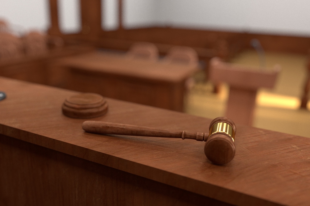 photograph of empty courtroom from Judge's perspective with gavel in foreground