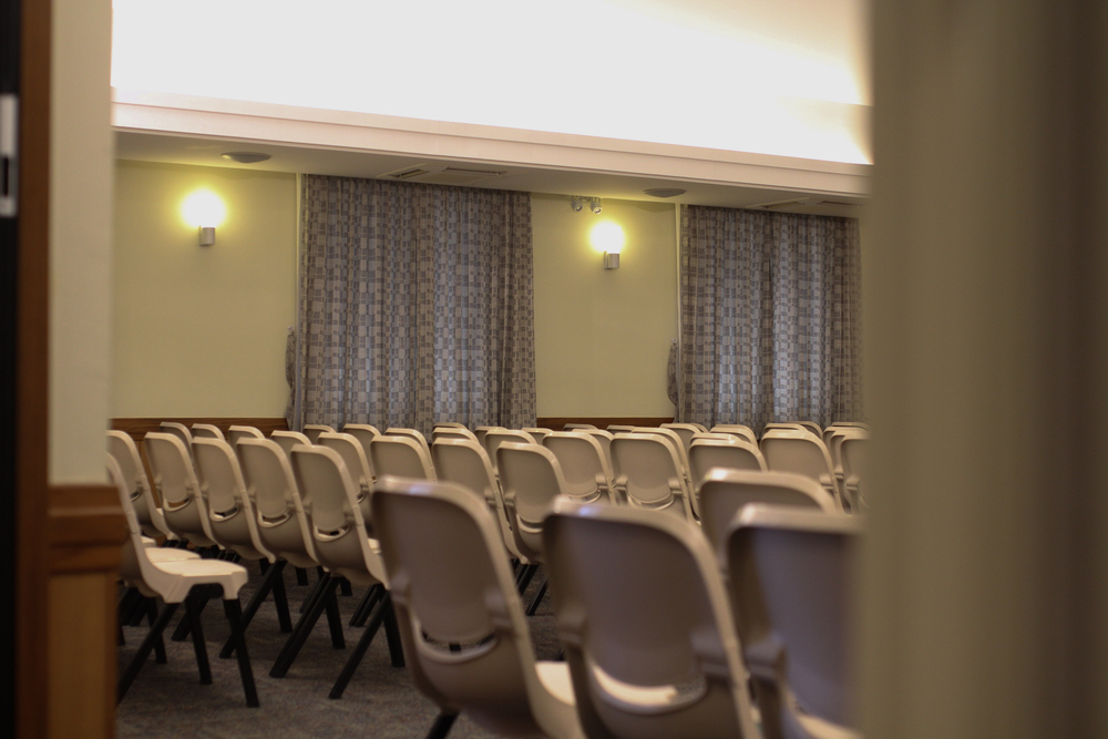 photograph of church doorway with chairs arranged