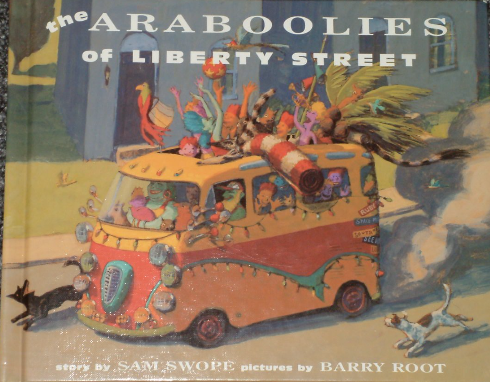 Illustrated book cover for The Araboolies of Liberty Street with a drawing of a colorful bus overflowing with happy people and animals. A gray house stands in the background.