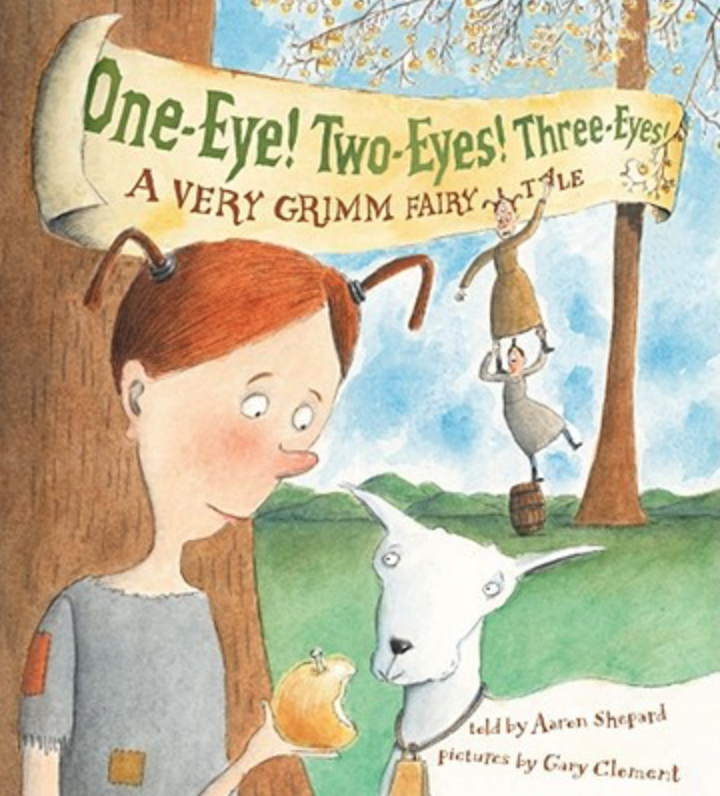 Illustrated book cover for One-Eye! Two-Eyes! Three-Eyes! featuring a girl giving an apple to a goat. The girl has two red pigtails and two eyes, and is wearing a patched-up shirt. In the background, her sister with three eyes and pigtails reaches for an apple as she stands on the shoulders of her sister with one eye and pigtail, who stands precariously on a barrel.