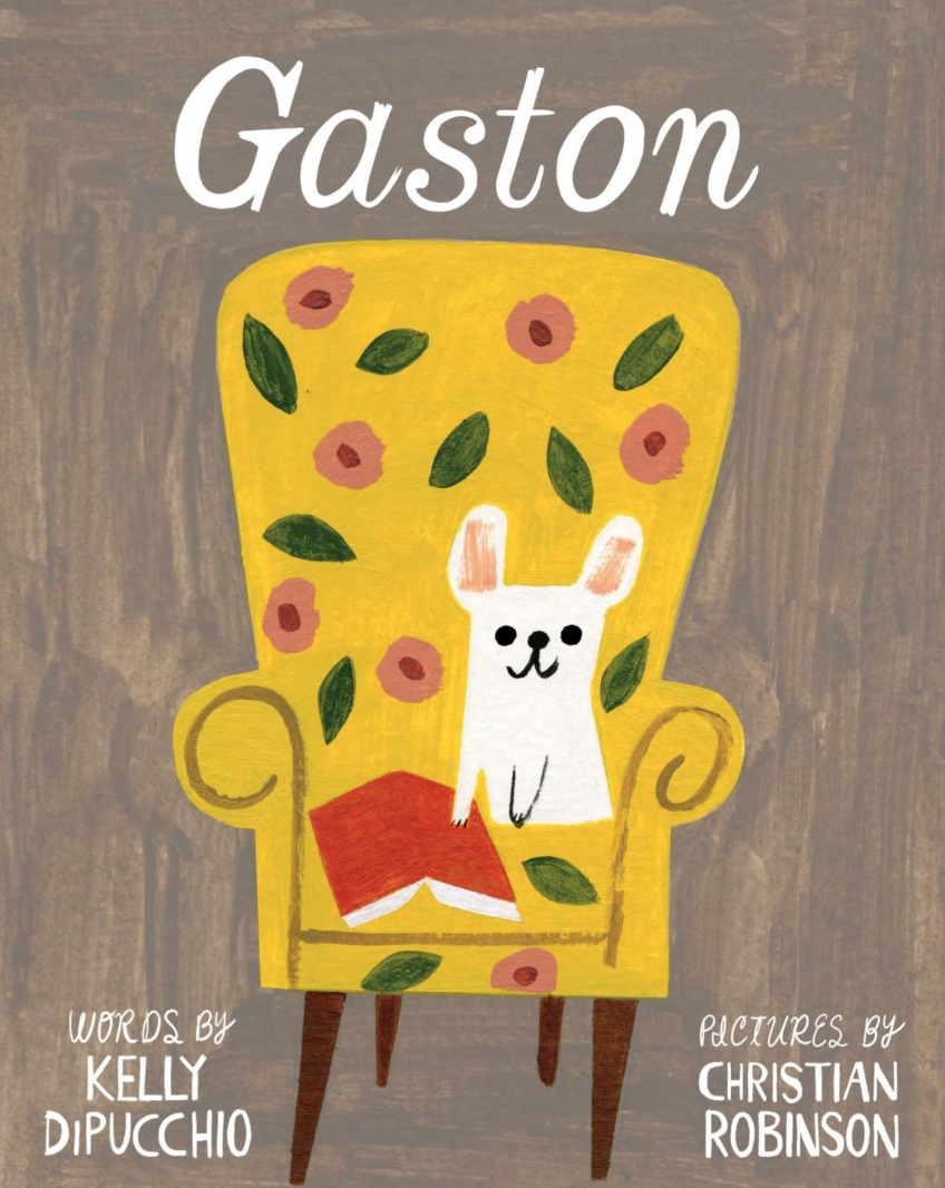 Illustrated book cover for Gaston featuring a little white bulldog sitting on a floral armchair. There is a red book next to him lying face down.