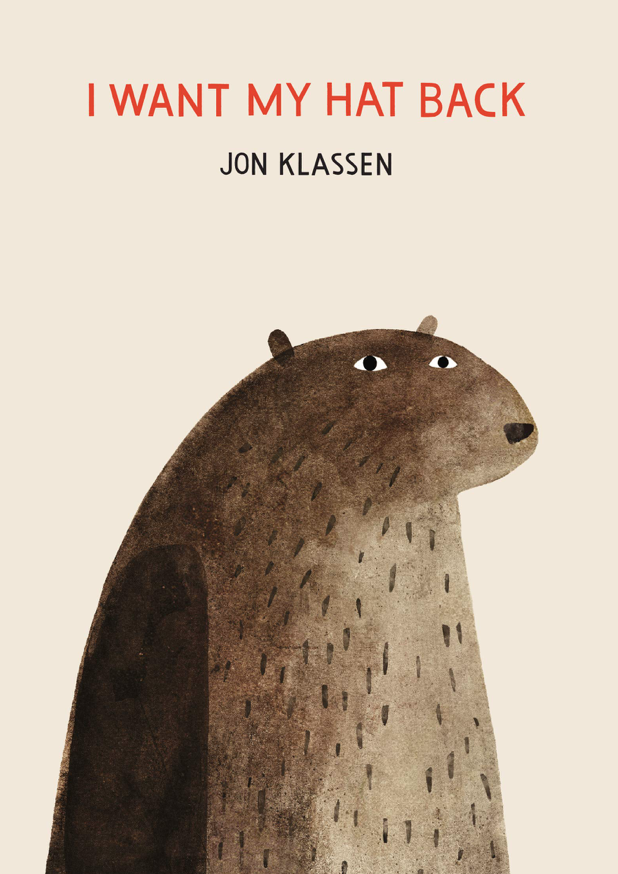 Illustrated book cover for Jon Klassen's book I Want My Hat Back that features a simple brush painting of a brown bear. The bear is stiff and expressionless, with his arms by his side.