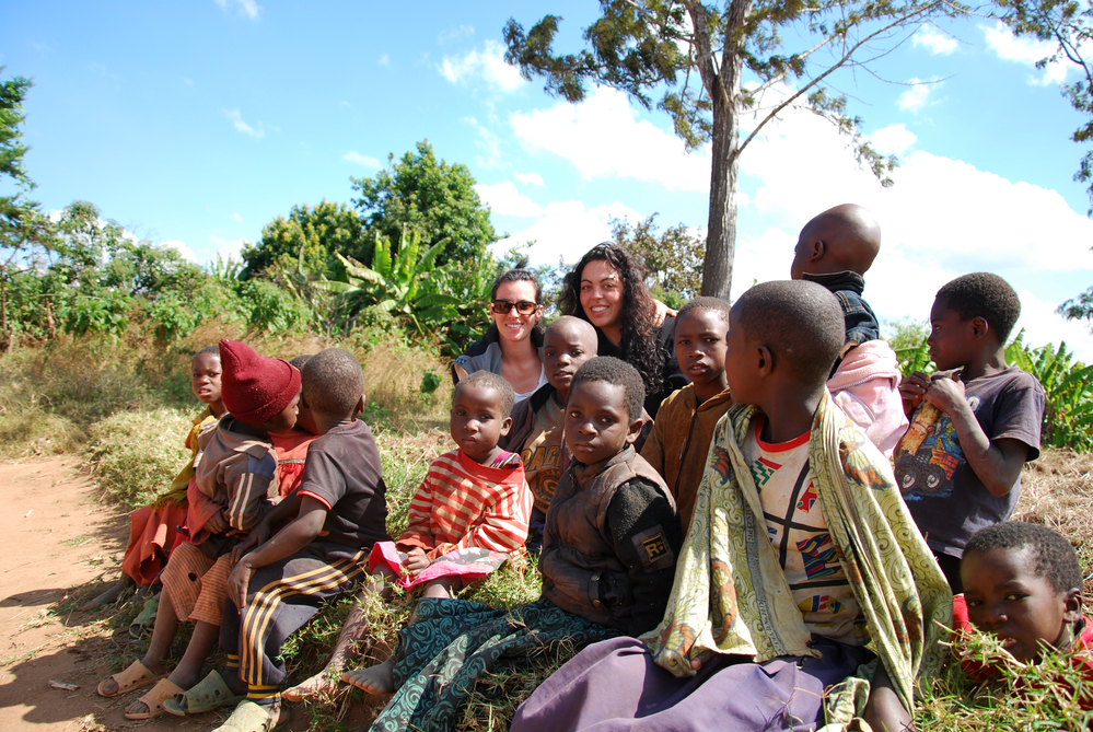 photograph of African children posing with white volunteers