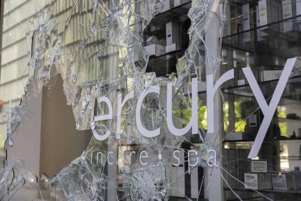 photograph of broken storefront window