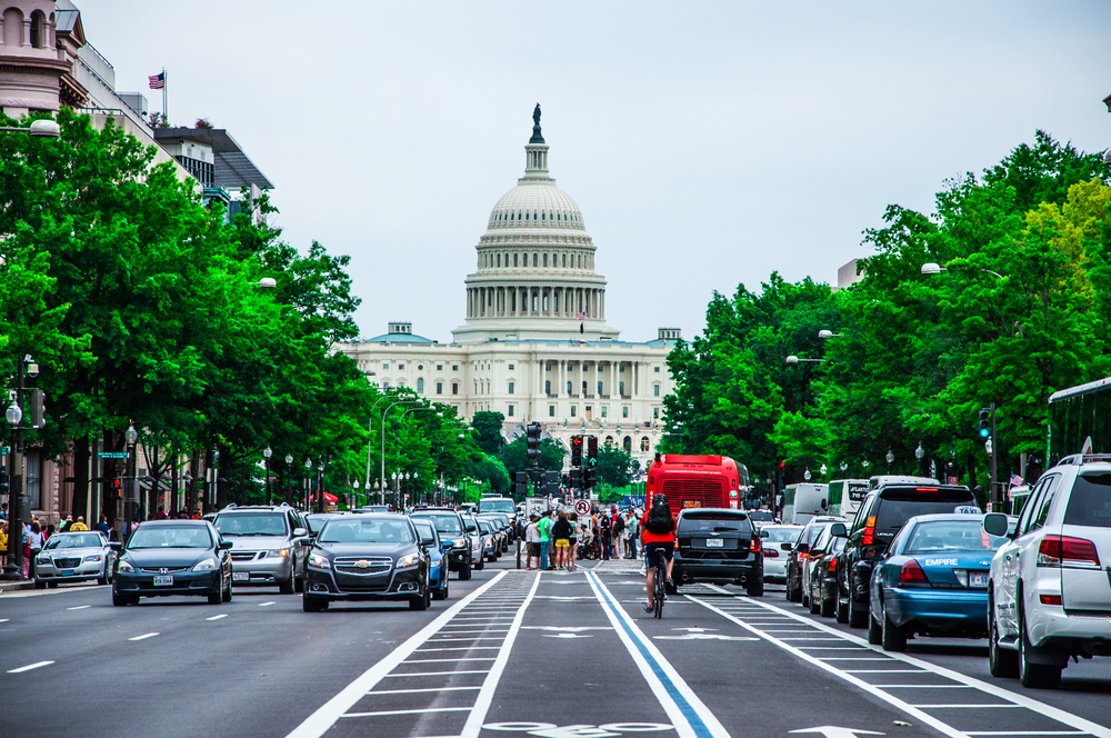 photograph of street traffic leading up to US Capitol building