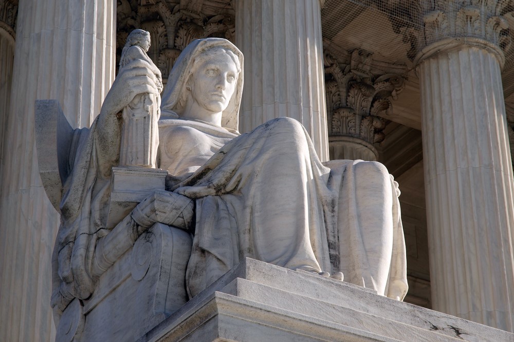 photograph of statue on the steps to the US Supreme Court