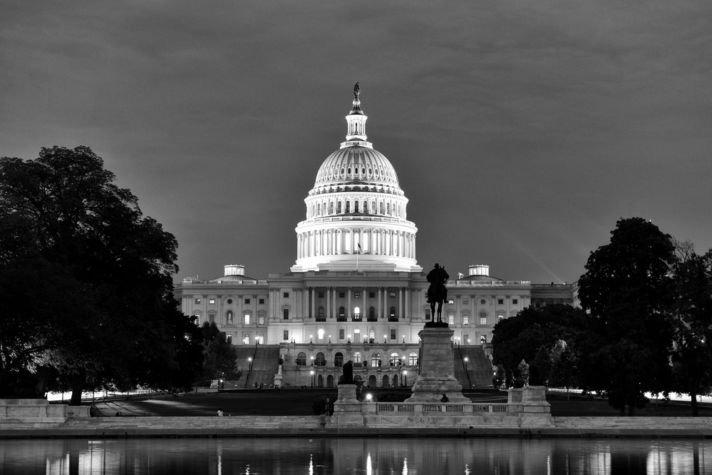 black-and-white photograph of the Capitol building at night