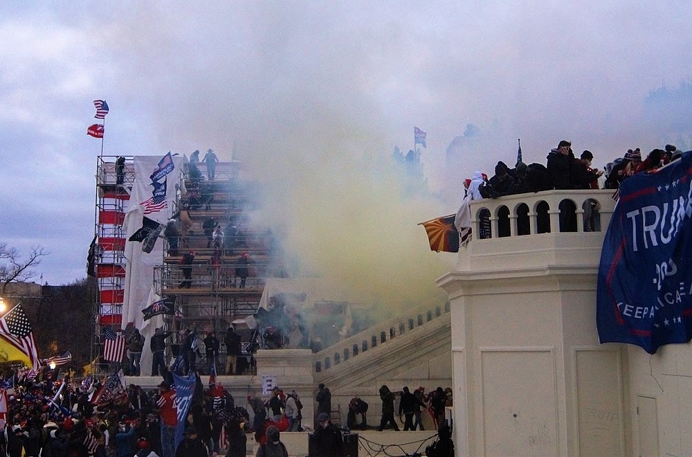 photograph of Capitol mob being tear gassed outside