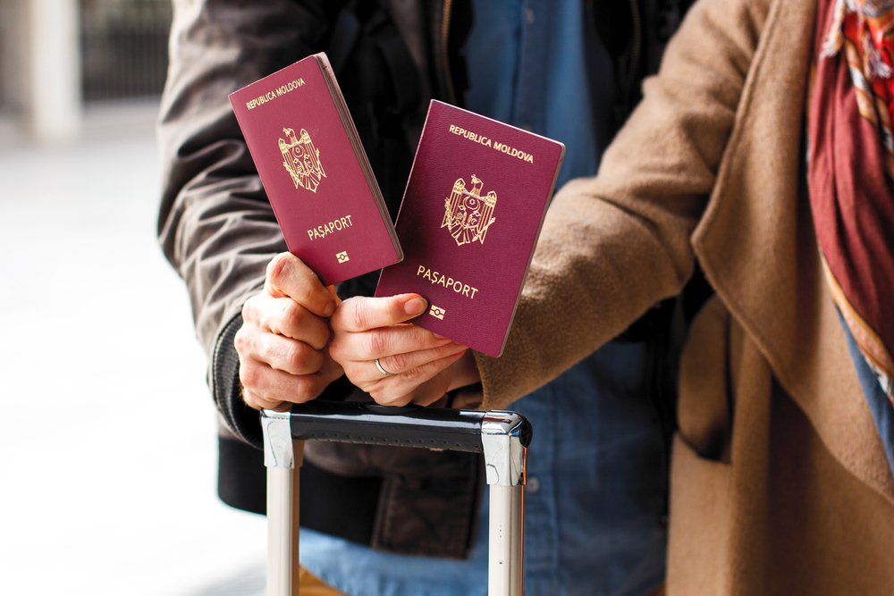 photograph of couple presenting passport