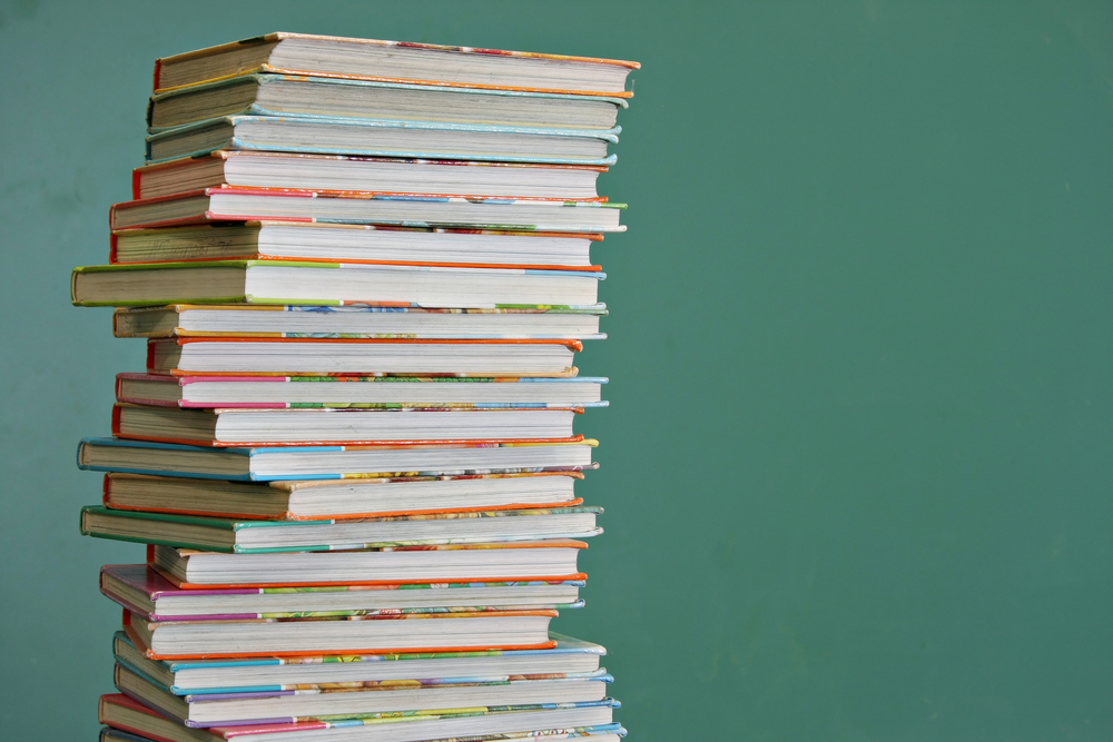 photograph of tall stack of children's books
